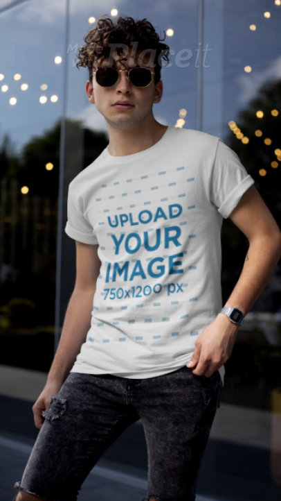 T-Shirt Video Featuring a Stylish Man Posing with His Sunglasses 