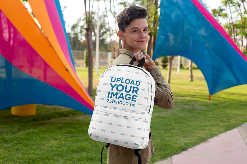 Placeit - Mockup of a Teenager Holding a Backpack over His Shoulder