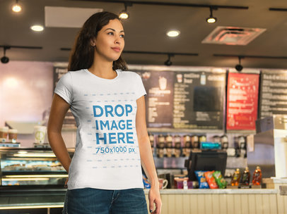  T-Shirt Mockup of a Beautiful Woman at a Coffee Shop