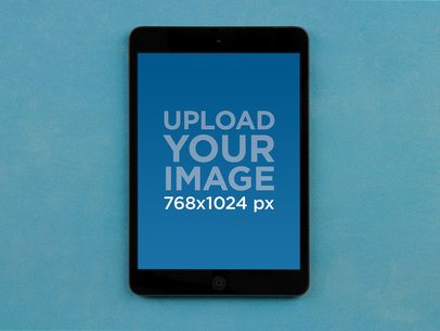 Mockup of an iPad Mini Placed on a Plain Surface