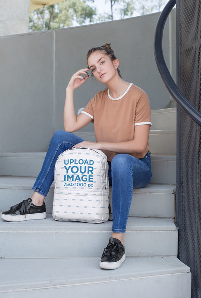 Backpack Mockup Featuring a Female Teenager Sitting on a Stairway 27721