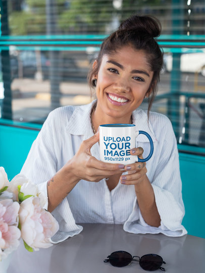 Mockup Featuring a Smiling Woman in a Coffee Shop Holding a Two-Toned 11 oz Coffee Mug 27829