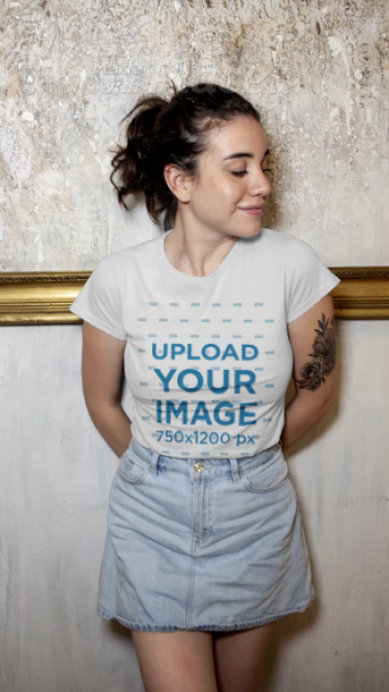 T-Shirt Video Featuring a Tattooed Woman Standing against a Marble Wall