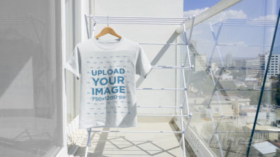 Video of a T-Shirt Hanging at a Sunny Balcony 13861