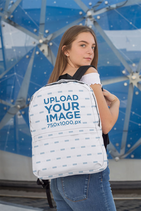 Mockup of a Female Teenager Carrying a Backpack over Her Shoulder