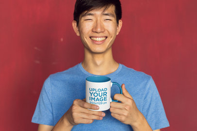 11 oz Two-Toned Mug Mockup Featuring a Joyful Man against a Red Background