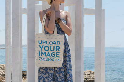Tote Bag Mockup Featuring a Woman by the Sea