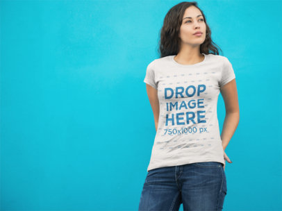 Woman Standing in Front of a Blue Wall T-Shirt Mockup