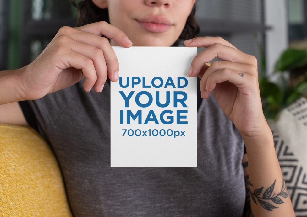 Placeit - Mockup of a Woman Holding an A6 Postcard