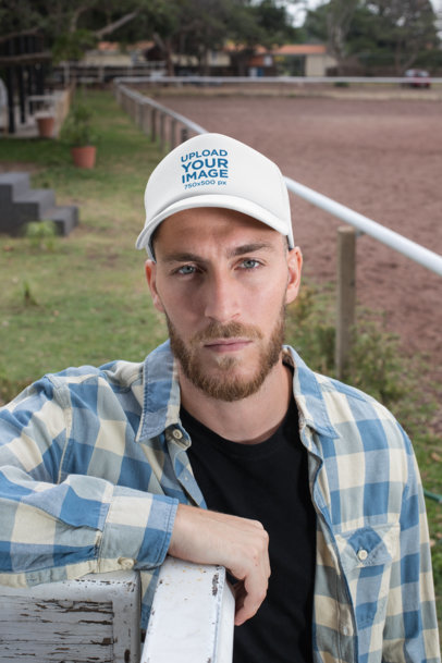 Trucker Hat Mockup of a Bearded Ranch Worker