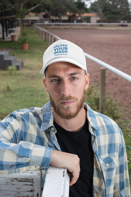 Placeit - Trucker Hat Mockup of a Bearded Ranch Worker