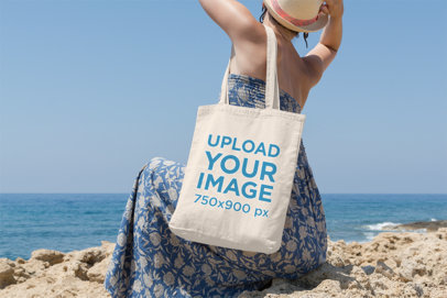 Tote Bag Mockup Featuring a Woman Facing Backward at the Beach