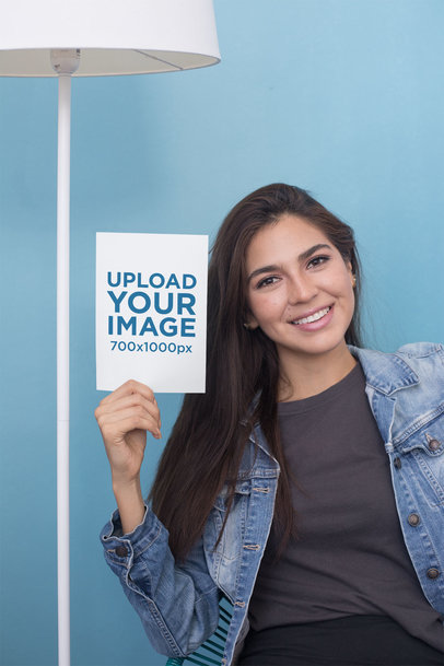 A5 Flyer Mockup Featuring a Young Woman Against a Blue Background