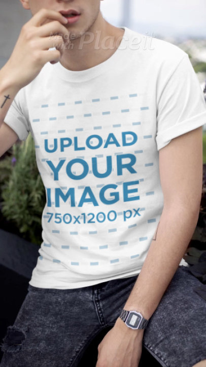T-Shirt Video Featuring a Young Man by a Planter 
