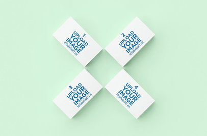  Mockup of Four Business Cards against a Solid Color Background