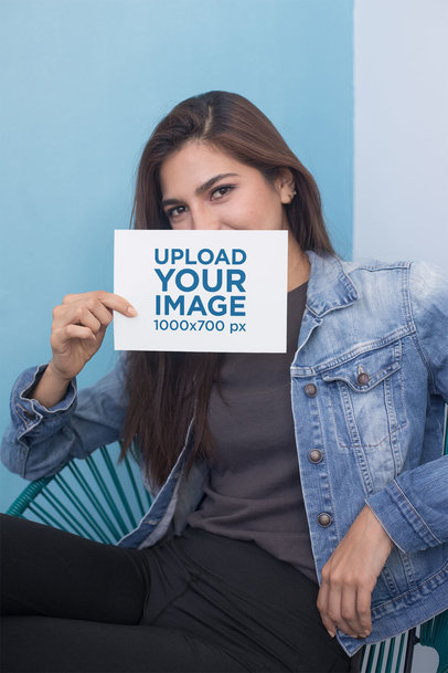 A5 Flyer Mockup Featuring a Relaxed Woman Sitting on an Acapulco Chair 