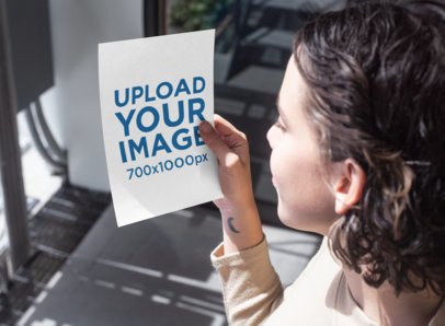Mockup Featuring a Woman Looking at an A5 Flyer 