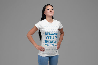 T-Shirt Mockup of A Proud Woman in a Patriotic Pose Against a Flag 