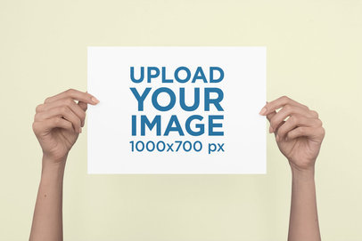 Mockup of a Woman's Hands Holding an A4 Flyer 