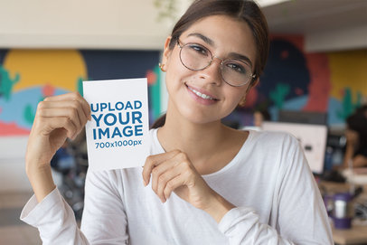 A6 Flyer Mockup Featuring a Smiling Woman with Glasses 27363