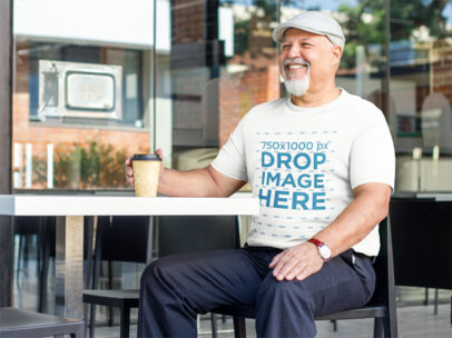 Elderly Man at a Cafe Enjoying a Coffee T-Shirt Mockup