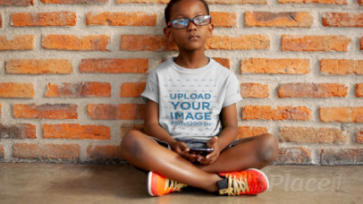 T-Shirt Video of a Little Boy Playing with a Phone