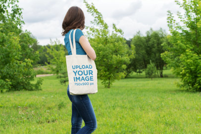 Tote Bag Mockup of a Woman at a Grove 20-el
