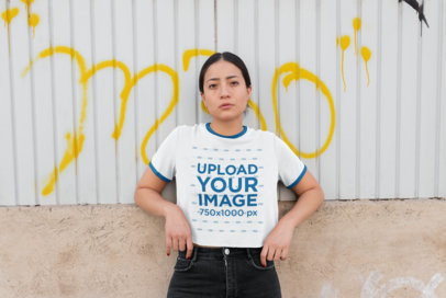 Ringer T-Shirt Mockup of a Woman Leaning Against a Wall with Graffiti