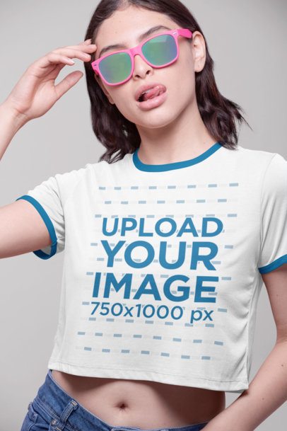 Ringer Tee Mockup Featuring a Woman with Sunglasses Taking out Her Tongue