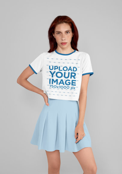 Mockup of a Woman Wearing a Ringer T-Shirt and a Skirt at a Studio 