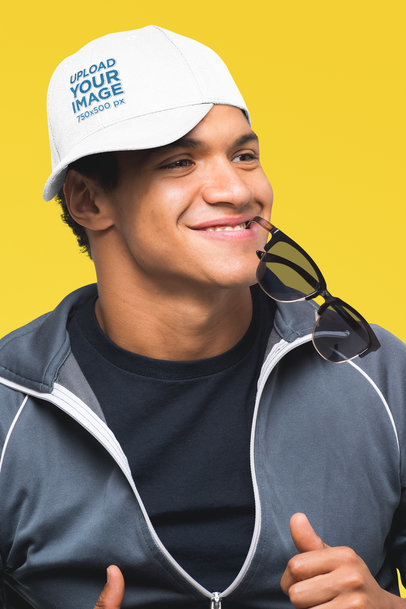 Mockup of a Man Wearing a Dad Hat and Biting His Sunglasses 27051