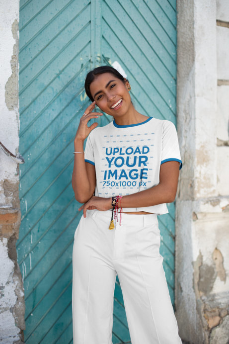 Ringer Tee Crop Top Mockup Featuring a Woman Outside an Old Building