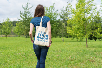 Mockup of a Woman Walking Towards a Grove While Carrying a Tote Bag 21-el
