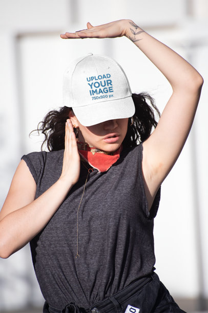 Mockup of a Woman with a Dad Hat Posing in The Street