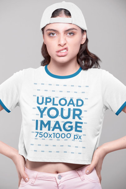 Ringer T-Shirt Mockup of a Woman Making a Funny Face at a Studio