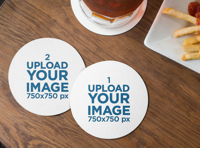 Mockup of Two Round Coasters Lying on a Wooden Table by Some Fries 27802