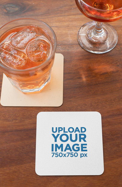Square Coaster Mockup Featuring Two Beverages on a Wooden Table