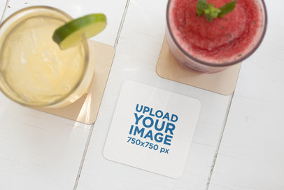 Square Coaster Mockup Featuring Two Drinks on a White Wooden Table