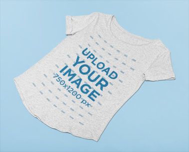 Slouchy Heathered Tee Mockup Lying Against a Minimalistic Flat Surface 27669