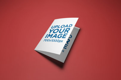 Mockup of a Bi-Fold A5 Brochure on a Plain Color Background 