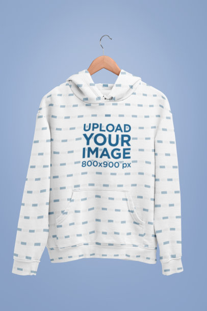 Mockup of a Pullover Hoodie Hanging Against a Simple Setting
