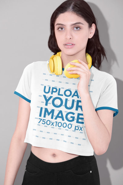 Crop Top Ringer Shirt Mockup of a Woman with Yellow Headphones 
