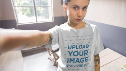 T-Shirt Video of a Tattooed Young Woman Taking a Selfie 