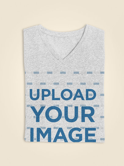 Folded Heathered Tee Mockup Over a Flat Surface