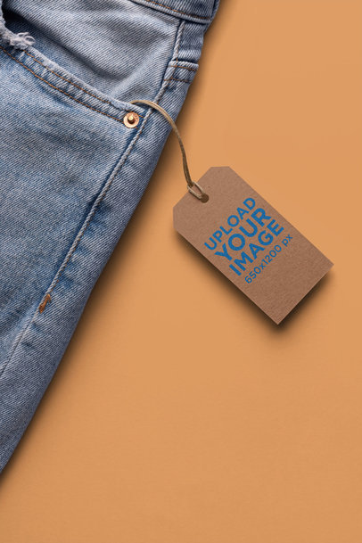 Brand Tag Mockup on Denim Jeans Against a Flat Surface