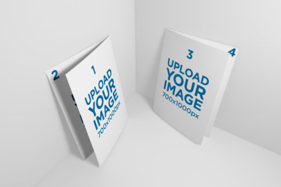 Mockup of Two Bi-Fold A5 Brochure Standing in a Color-Customizable Corner