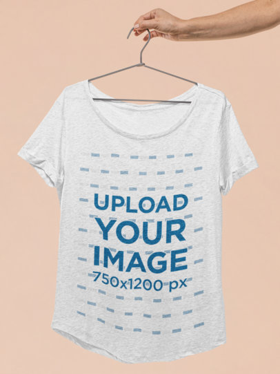 Mockup of a Hand Holding a Slouchy Women's T-Shirt 