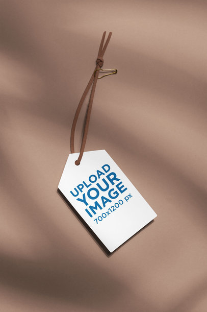 Mockup of a Brand Tag with a Leather Lace
