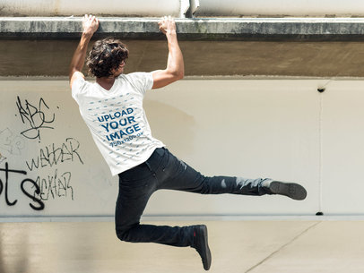 Back Shot of a Man Hanging From a Bridge T-Shirt Mockup a6087