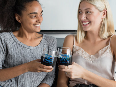 Mockup of Two Friends Clinking Stemless Wine Glasses 27946